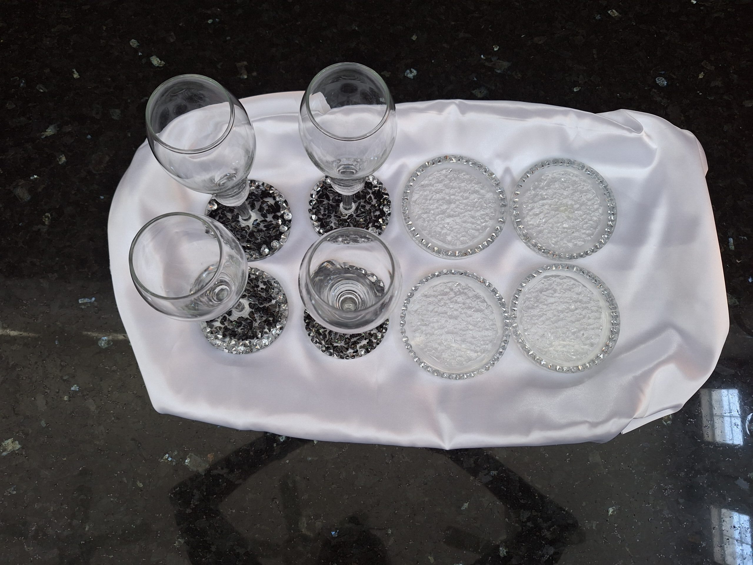 crystal and obsidian champagne glasses and crystal coaster set